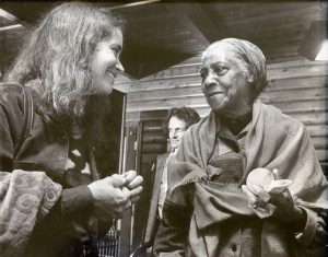 Linda Waterfall and Elizabeth Cotten at Puget Sound Guitar Workshop, 1981. In the background is Mike Seeger.